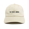 Beige cap with 'The Dude Abides' text on a white background